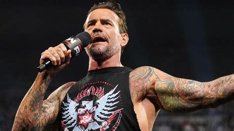 adults watch fake wrestling